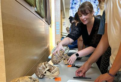 Kimberly Paczolt helping students during a class activity
