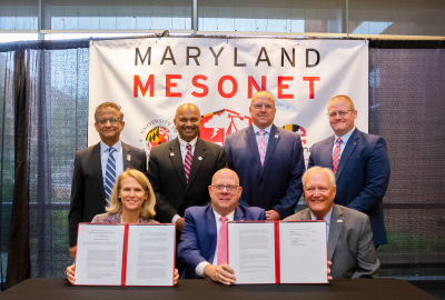UMD and State of Maryland leaders pose with the agreement for the Maryland Mesonet