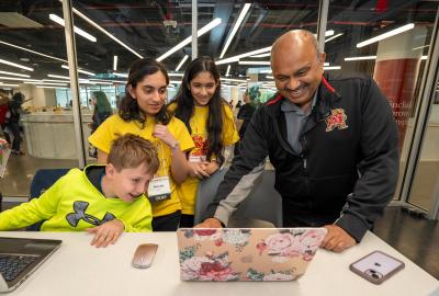 CMNS Dean Amitabh Varshney learns about CompSciConnect camper projects at Maryland Day 2024.