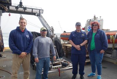 Jake Schlenoff (left) and others aboard the ship