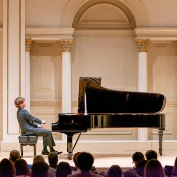 Jacob Goldman performing piano on stage at Carnegie Hall. Photo courtesy of Jacob Goldman.