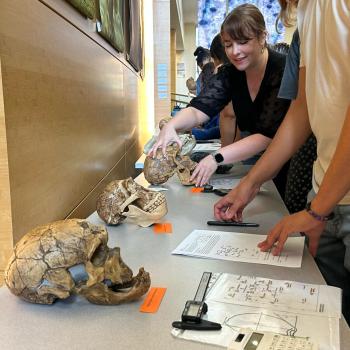 Senior Lecturer Kimberly Paczolt helps students with a hands-on activity during a class in October