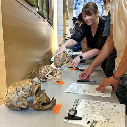 Kimberly Paczolt helping students during a class activity