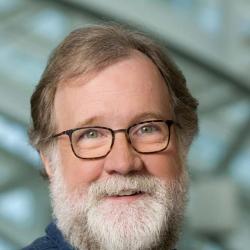 Evolutionary Biologist Sean B. Carroll, bearded with glasses.