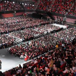 Commencement at the Xfinity Center. A high view of the huge crowd of students and guest.