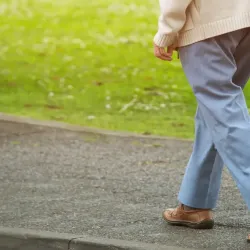 Person walking with cane 